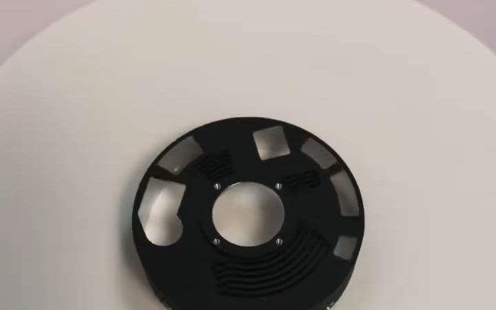 Black anodized aluminium carrier with bright bare-metal machined pockets