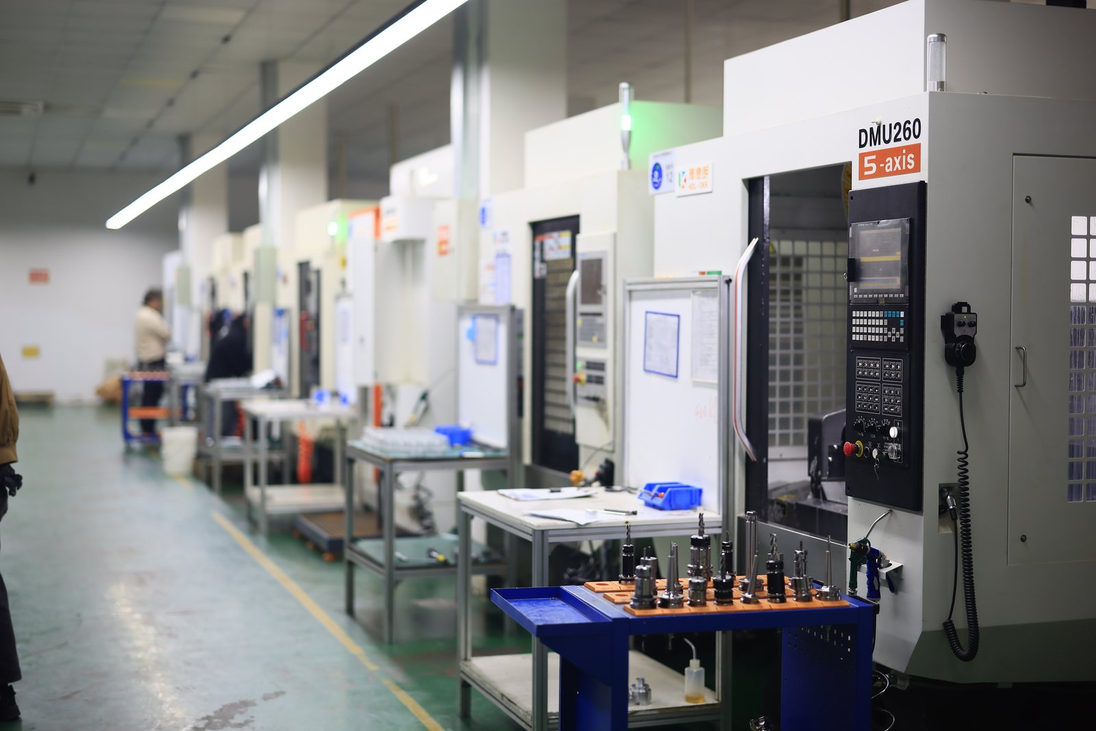5-axis CNC machine aisle on a clean production floor