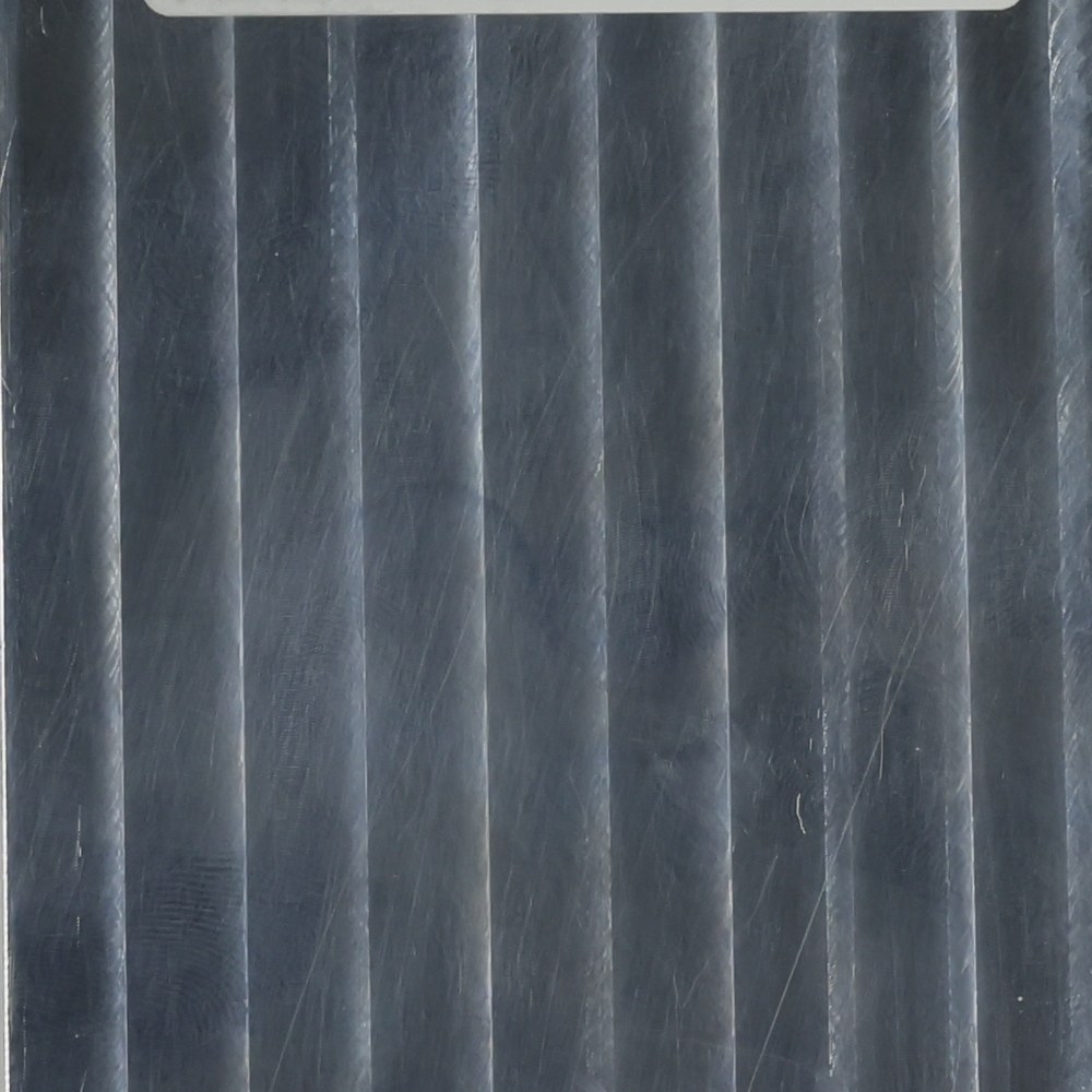 Bare as-machined 6061 aluminium part with visible tool marks
