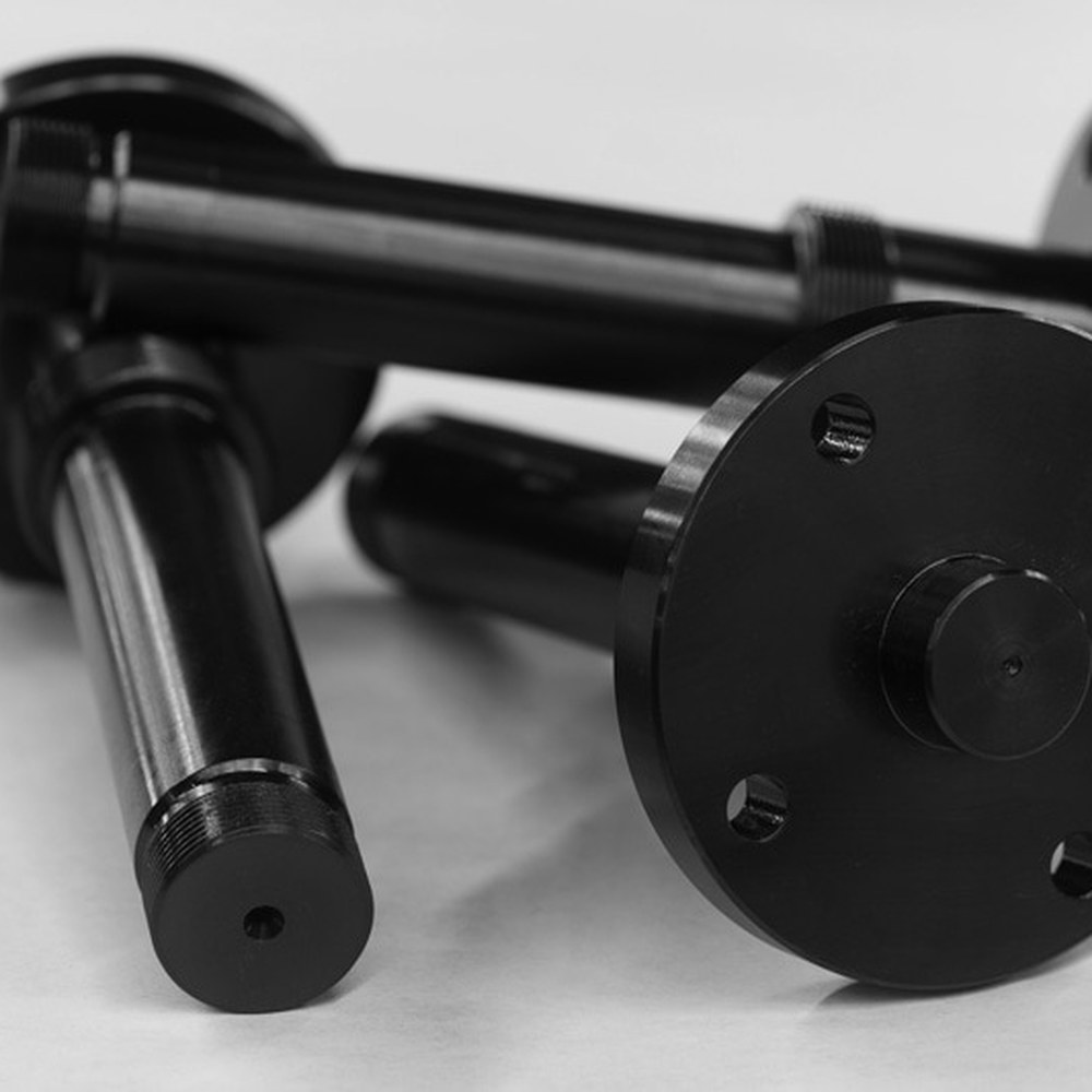 Black-oxide steel with a matte black conversion coating