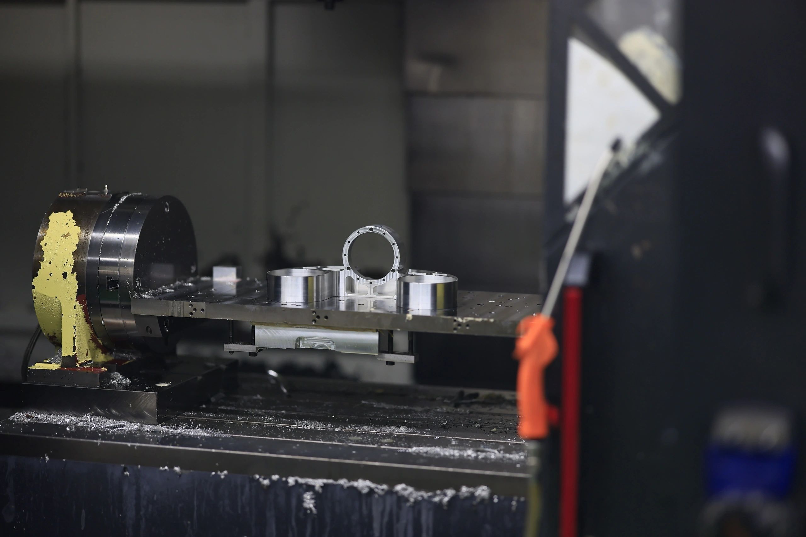 CNC machined aluminium bore and flange components on a horizontal machining pallet