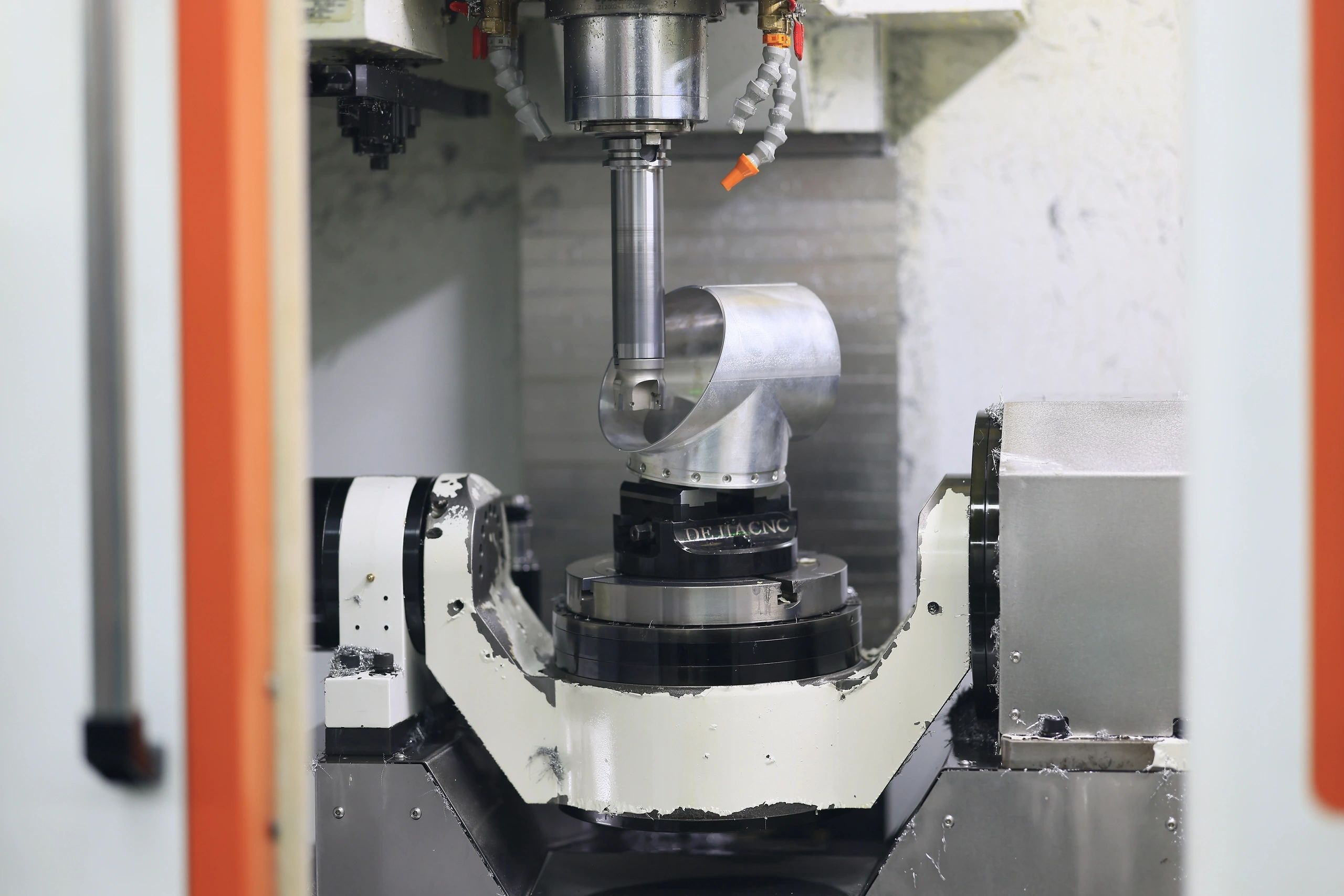 5-axis machined aluminium elbow housing on the trunnion table