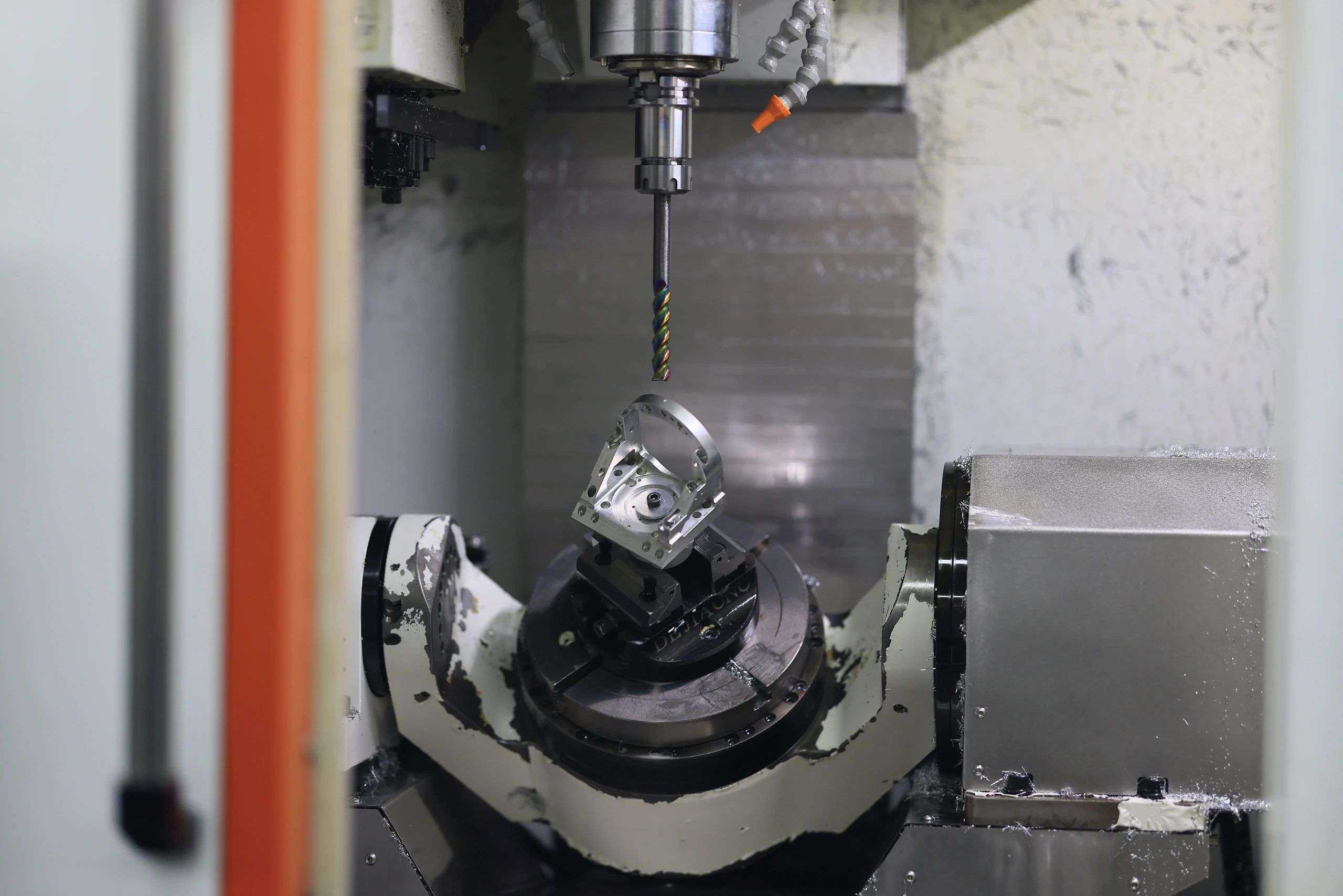 5-axis machined aluminium contoured bracket on the trunnion table