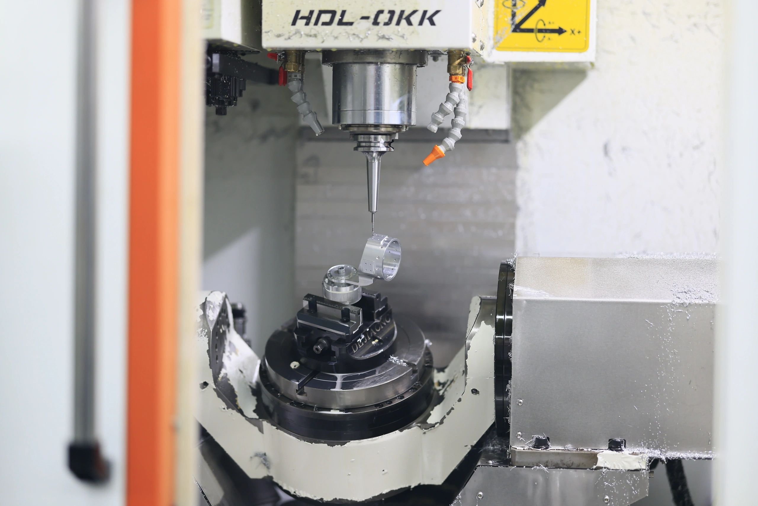5-axis machined aluminium ring collar held in the chuck