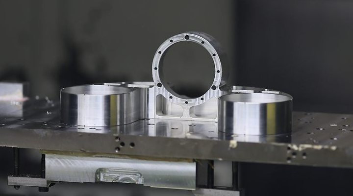Machined aluminium humanoid robot waist components on the machine bed