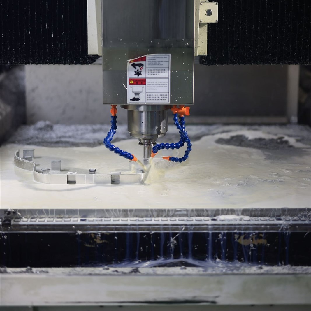 Spindle head and way covers during a coolant-flooded machining pass