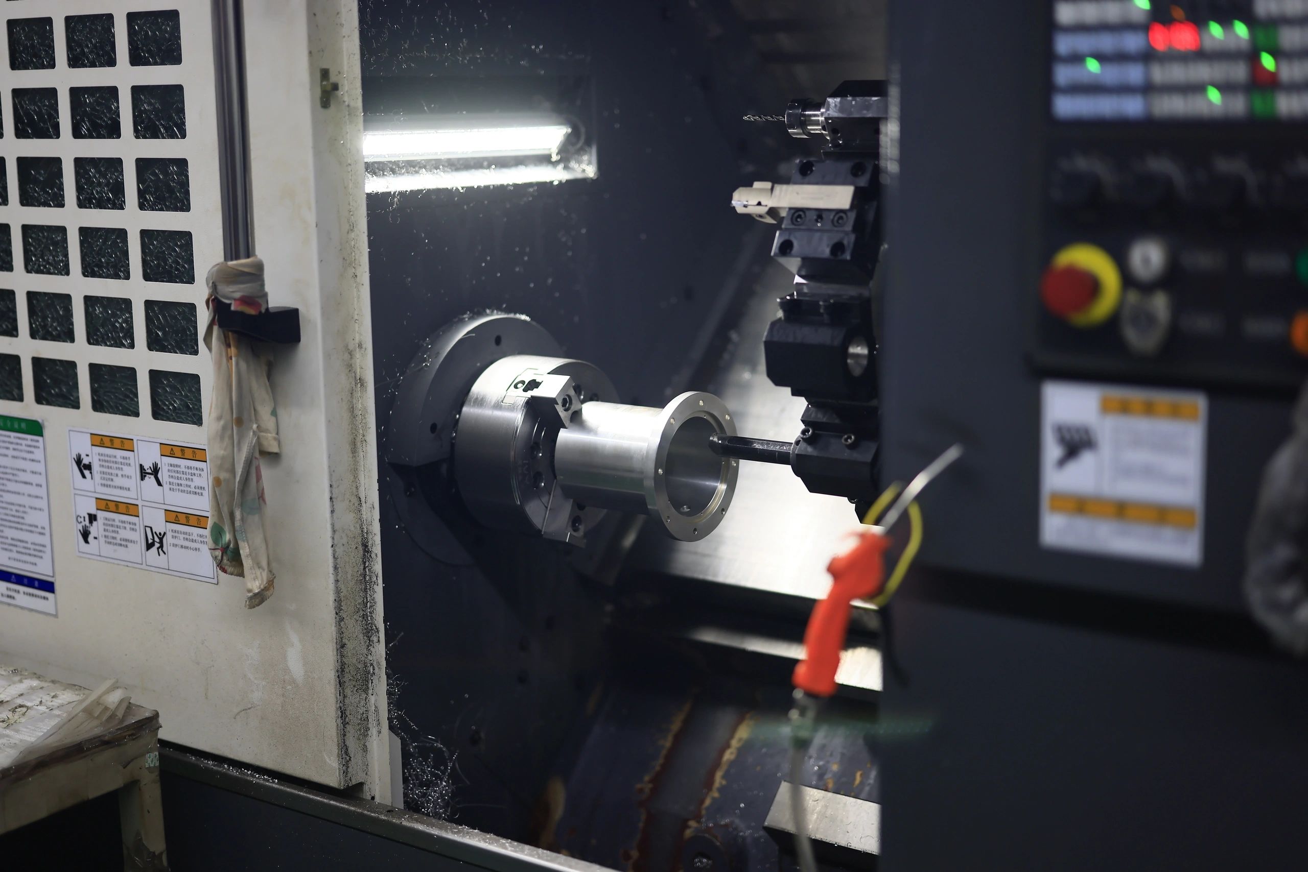 CNC turning of a precision component in a chuck lathe.